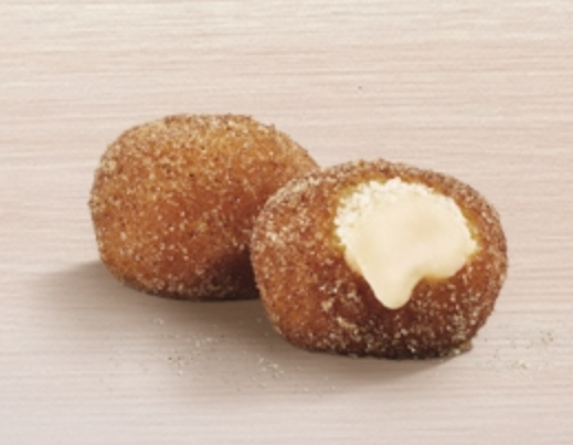 A picture of 2 cream filled donut balls