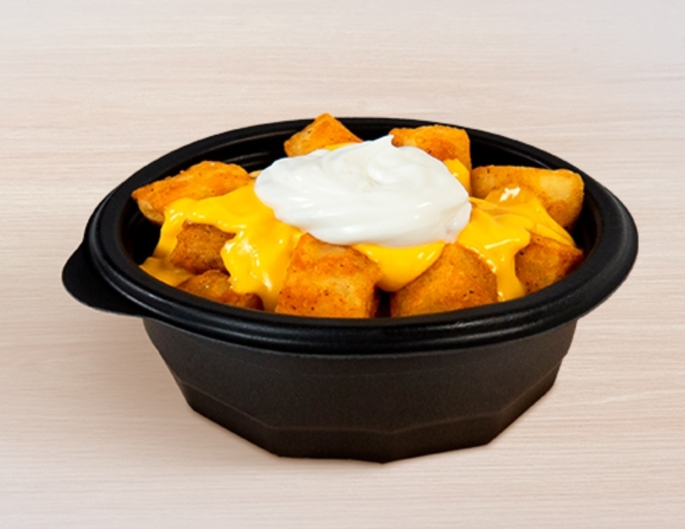 A picture of cheesy potatos with sour cream